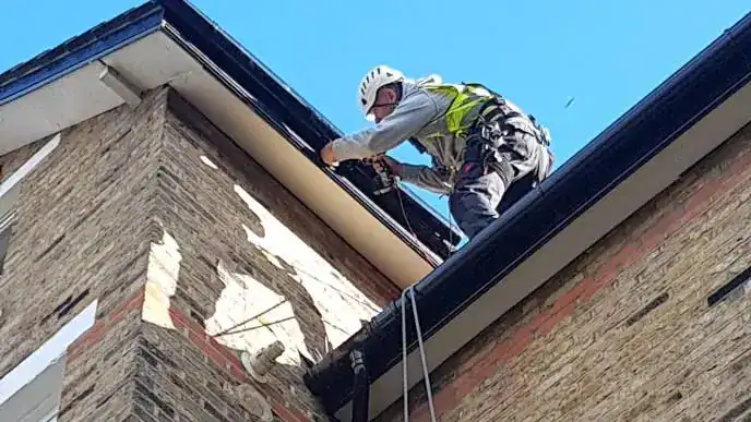 Emergency roof repair London engineer replacing damaged roof timber